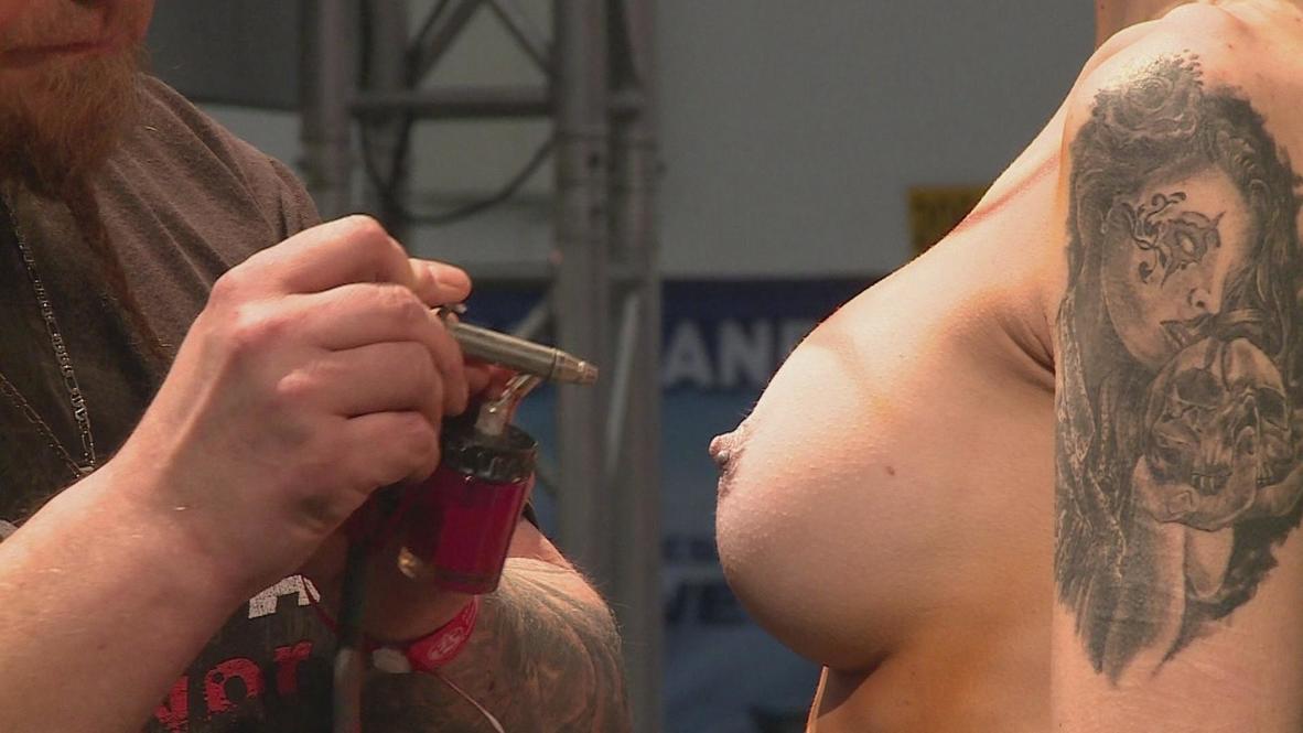 Germany: Tattoo convention displays the beauty of temporary tattoos EXPLICIT MATERIAL