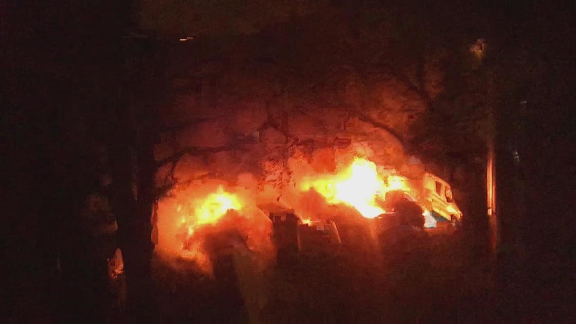 Germany: Police cars burn in German financial hub