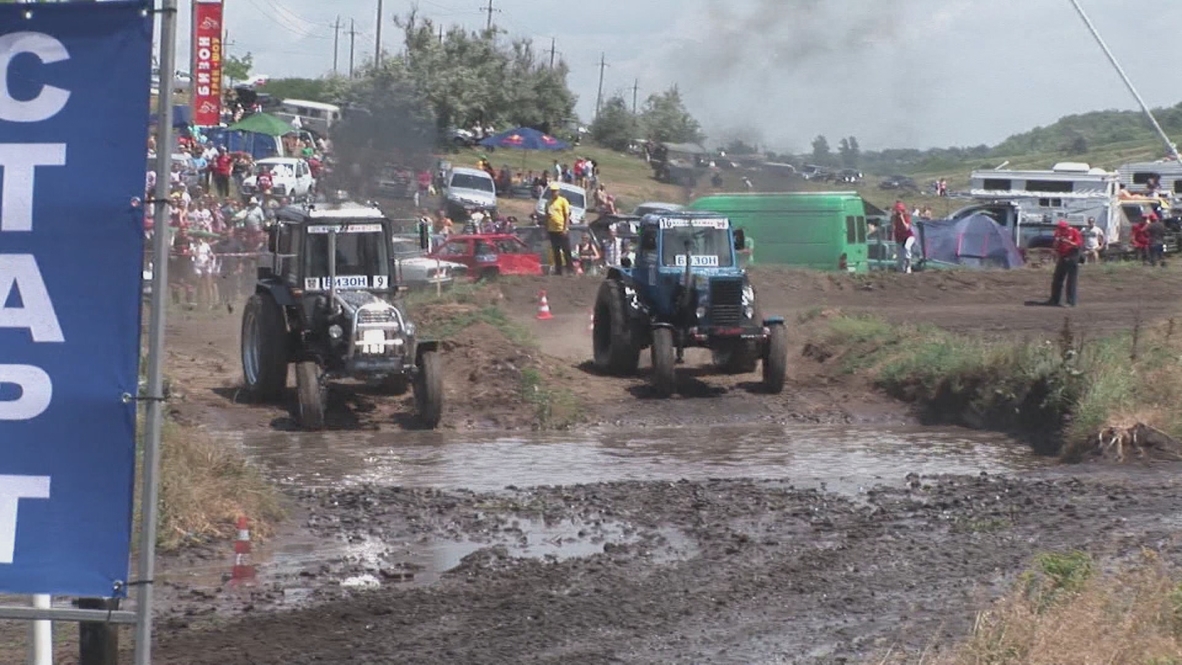 Russia: Rural Russians in Turbo tractors tear up the track at Bizon