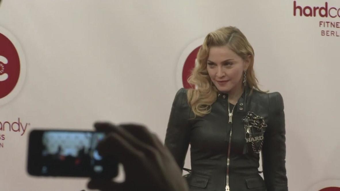 Germany: Madonna strikes a pose at her fitness club launch