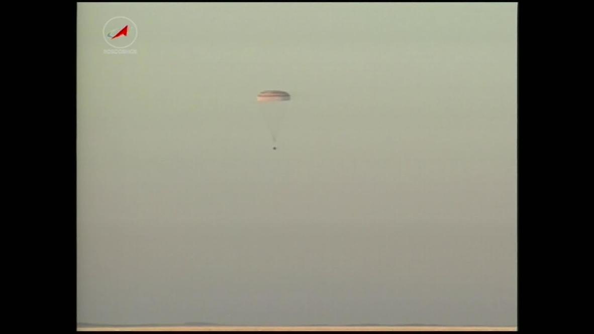 Olympic torch returns to earth with Soyuz space crew