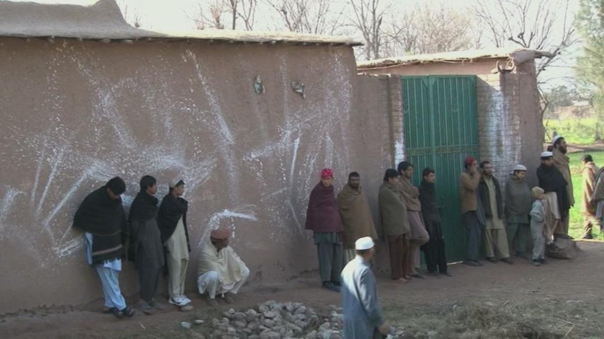 Pakistan: Villagers gather outside slain anti-Taliban militia chief's house