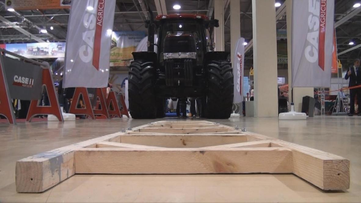 Russia: Watch this man pull an eight-tonne tractor