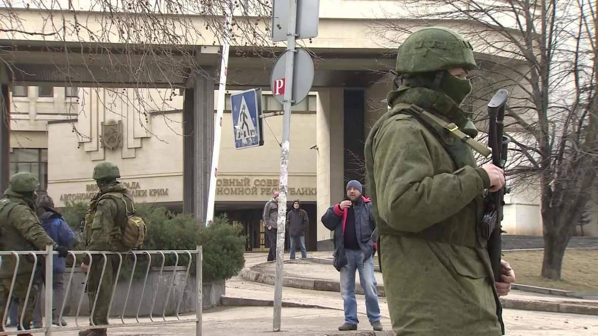 Ukraine: Members of local self-defense units patrol the streets around Crimean Parliament