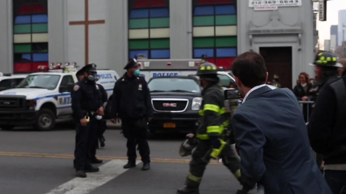 USA: Smoke from Harlem building explosion clouds NYC skyline