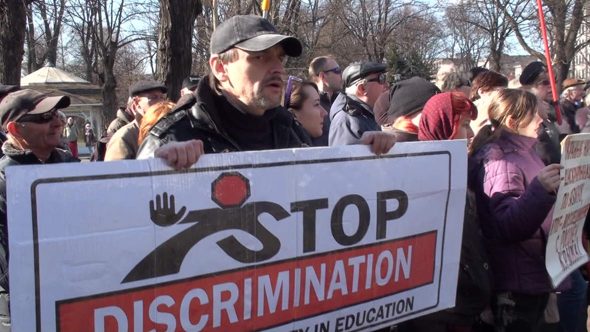 Latvia: Activists chant 'Hands off Russian schools' in Riga