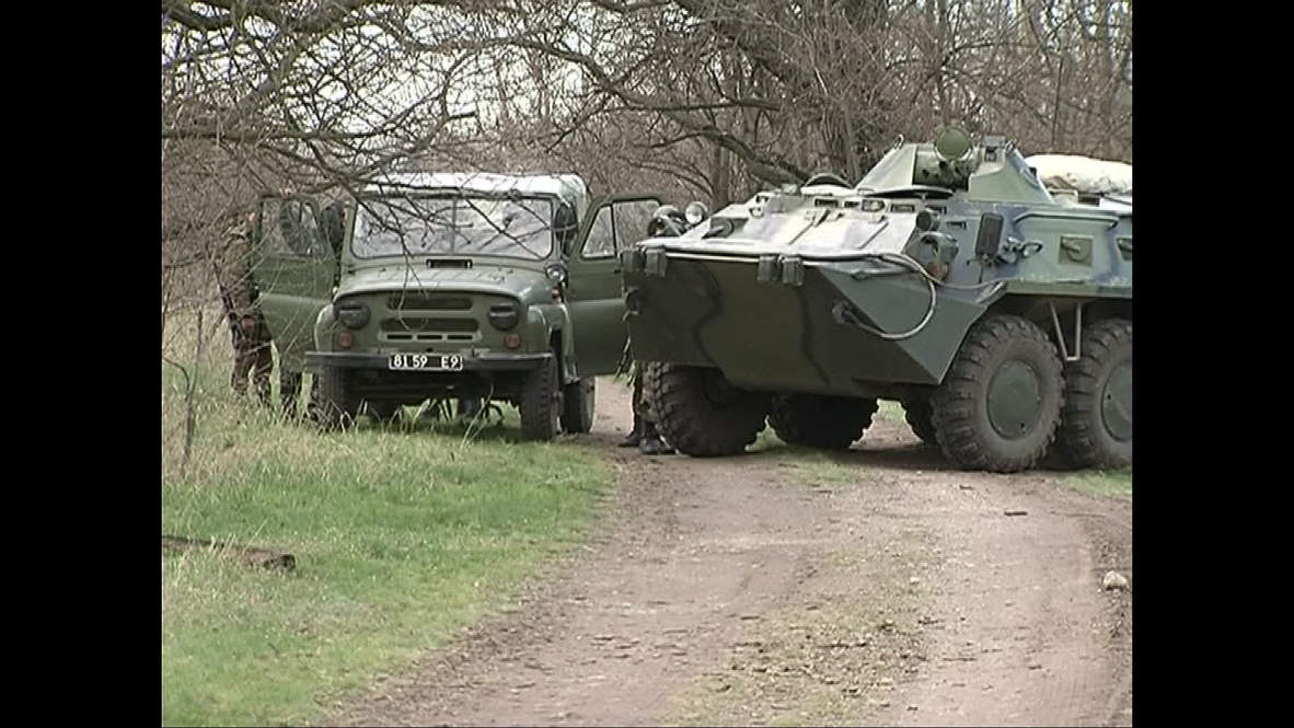 Ukraine: Locals block path of Ukrainian military with BTR-80s