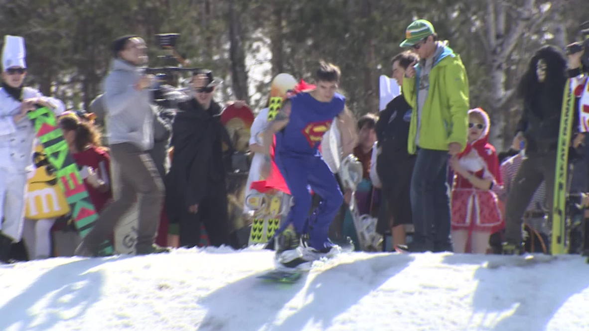 Russia: Watch snowboarders in crazy costumes plunge into icy water