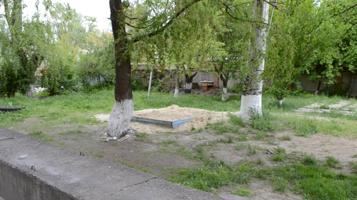 Ukraine: Young boy wearing St. George's ribbon shot in Slavyansk