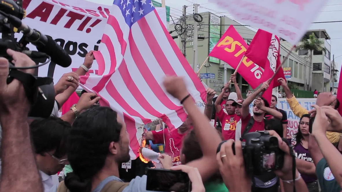 Brazil: Anti-FIFA protesters burn US flag
