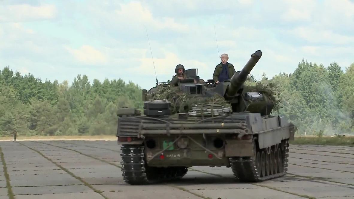 Lithuania: Grybauskaite takes a ride on a Leopard 2 A5 during Saber Strike 2014