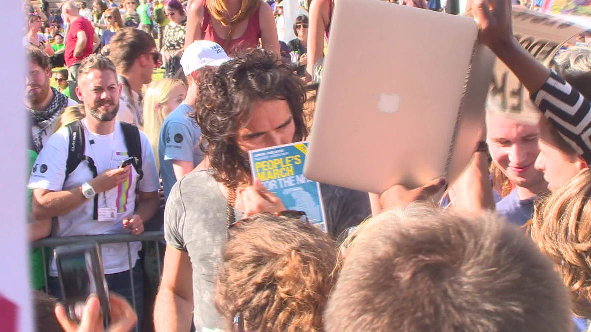 UK: Russell Brand calls for "revolution" during anti-austerity protest