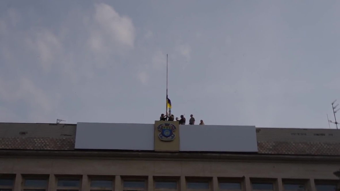 Ukraine: Ukrainian flag flies high over former Kramatorsk DPR hq