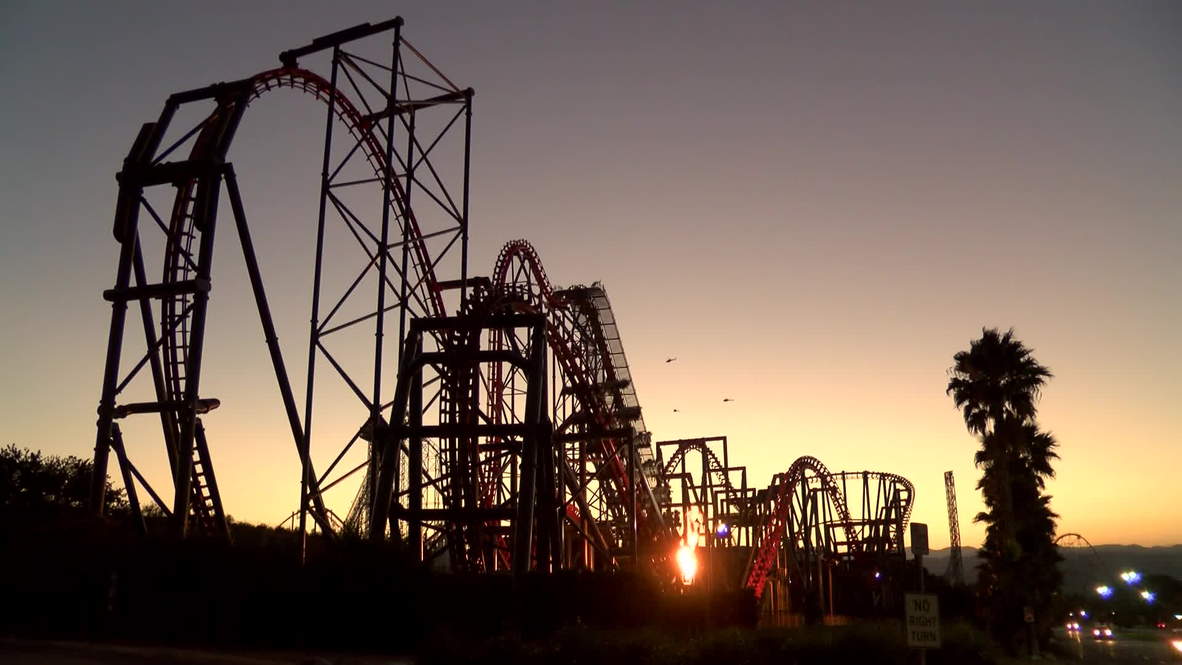 USA: Roller coaster riders left dangling mid-air