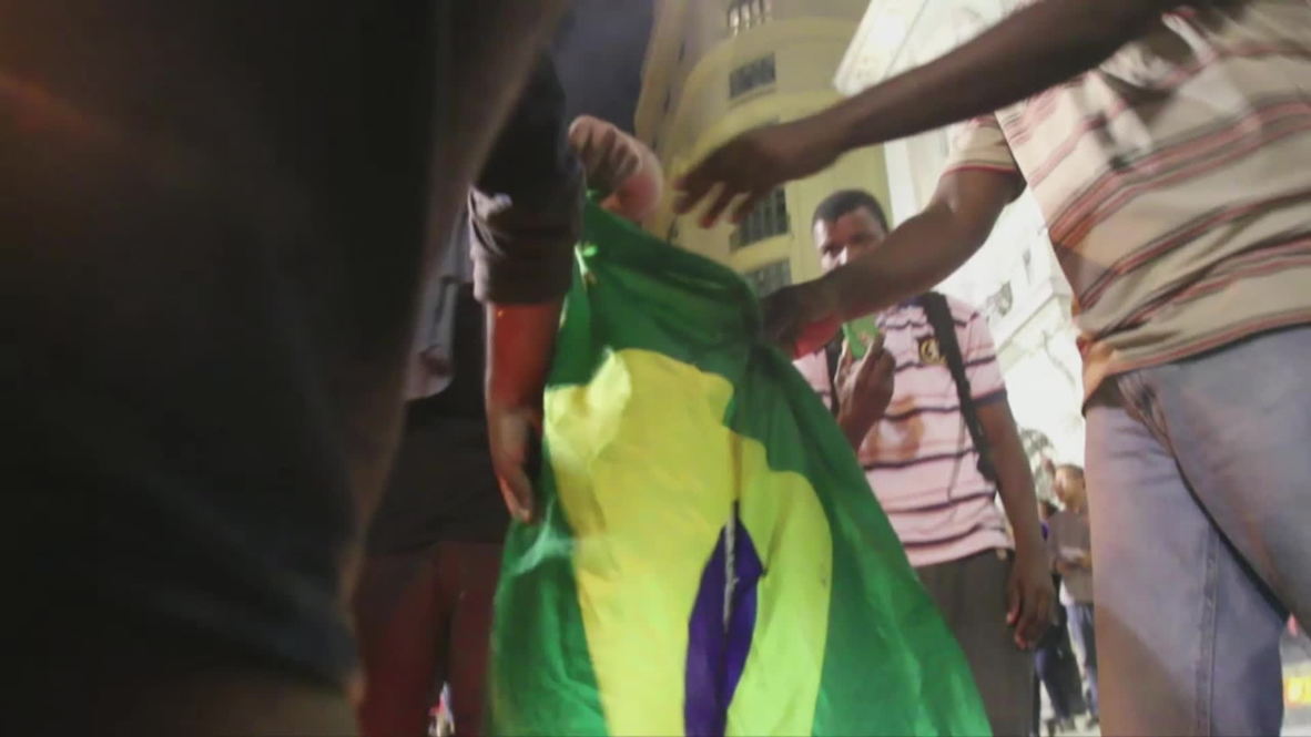 Brazil: Anti-FIFA protesters burn Brazilian flag