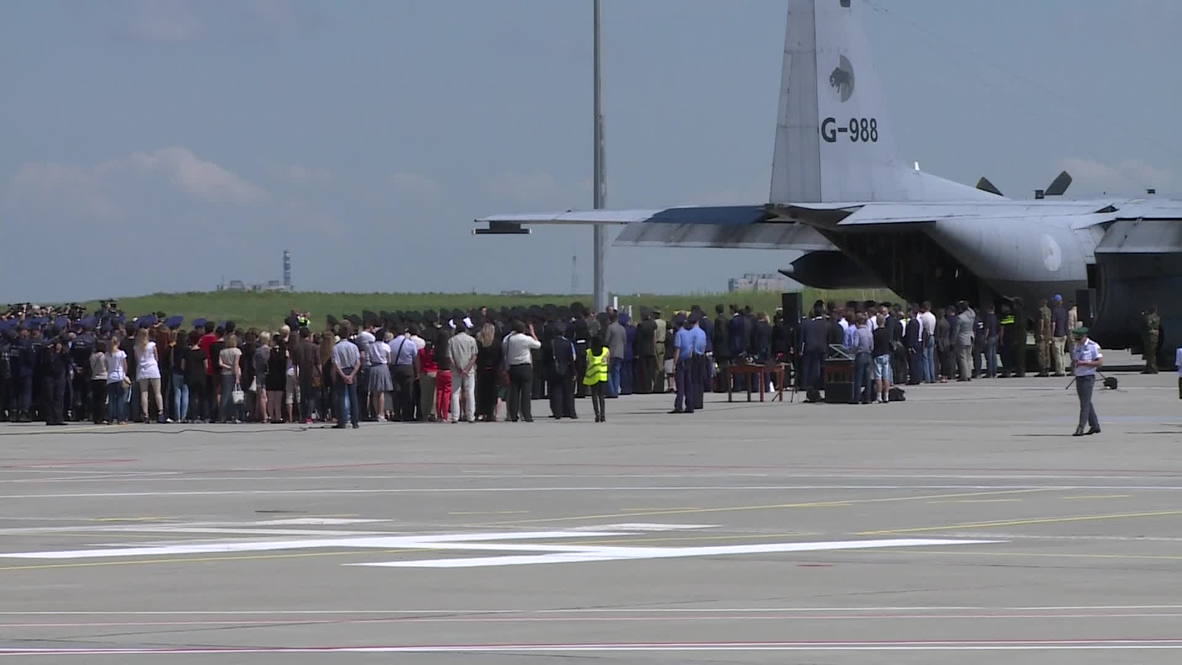 Ukraine: MH17 crash victims' bodies loaded onto plane in Kharkov