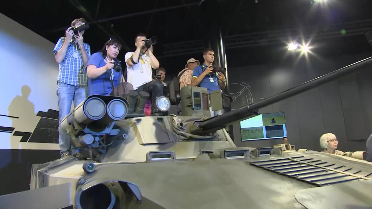 Russia: Steven Seagal wields Russian sniper rifles at OboronExpo 2014