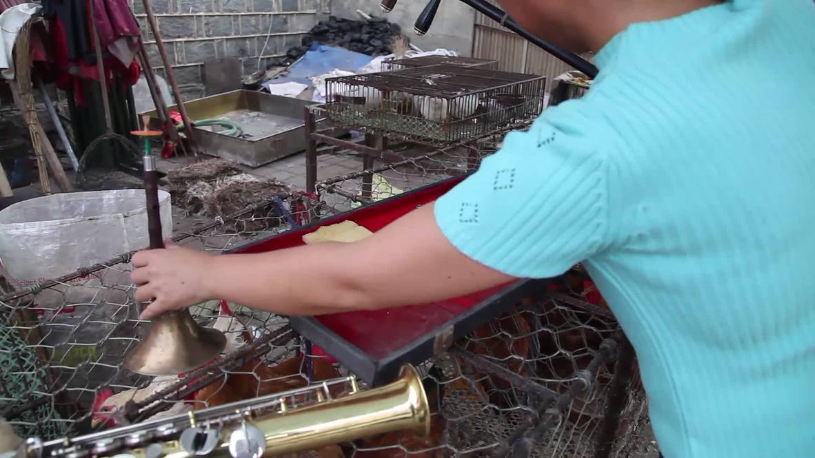 China: Meet "Mrs Chicken Killer," the knife-wielding musical genius with blood on her hands