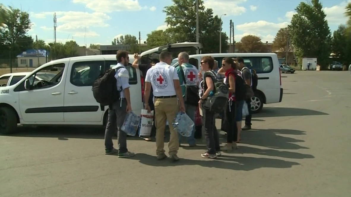 Russia: Red Cross officials arrive at Russian aid convoy