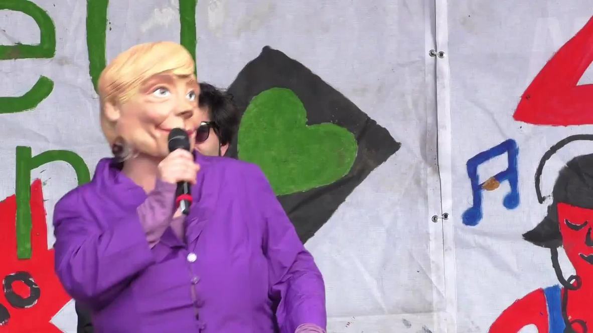 Germany: See Merkel dance with polar bear at Berlin climate change rally