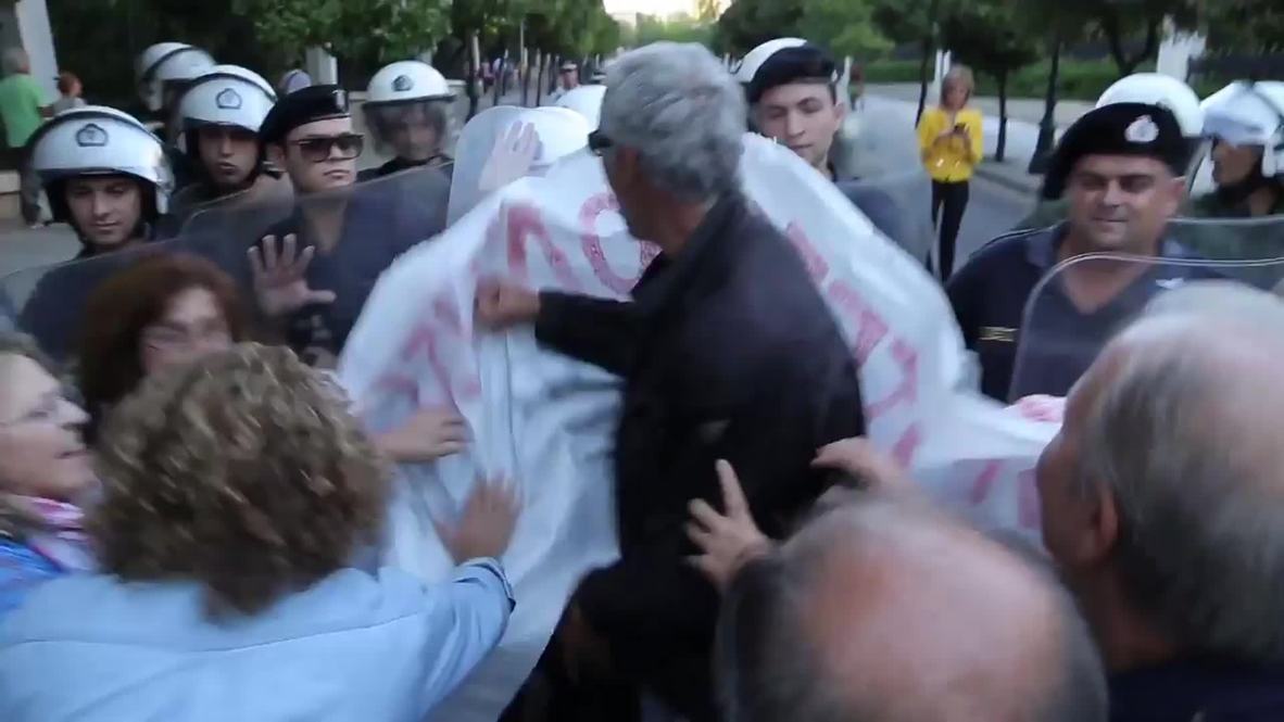Greece: Watch protesters clash with riot police in Athens