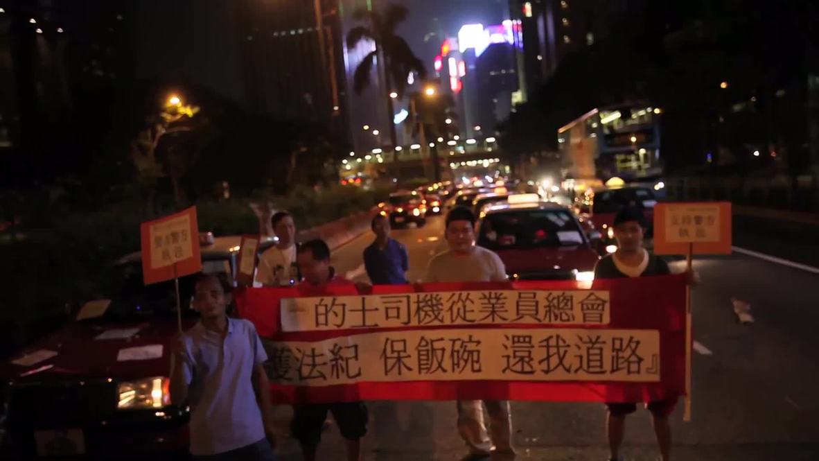 Hong Kong: Angry cabbies GRIDLOCK HK's busiest street