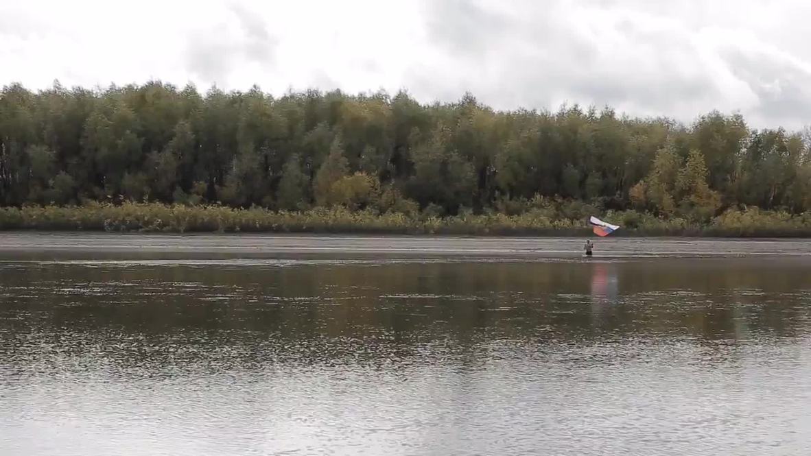 Russia: Siberian 'Polar Bear' honours Putin with ice-cold swim