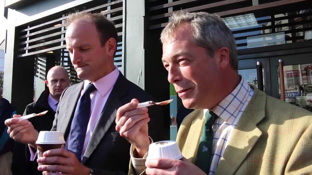 UK: He's lovin it! Farage shares a McFlurry with Carswell