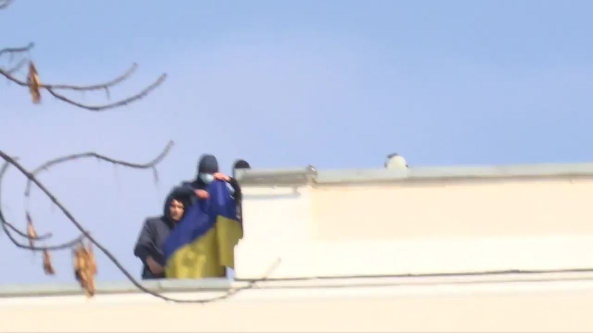 Ukraine: Protesters seize ministry rooftop, unfurl national flag