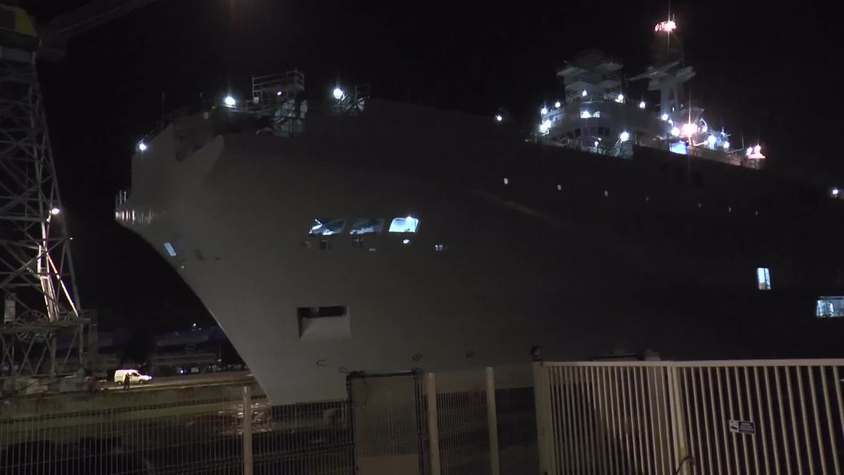 France: Russia's disputed Mistral warship tugged to dry dock