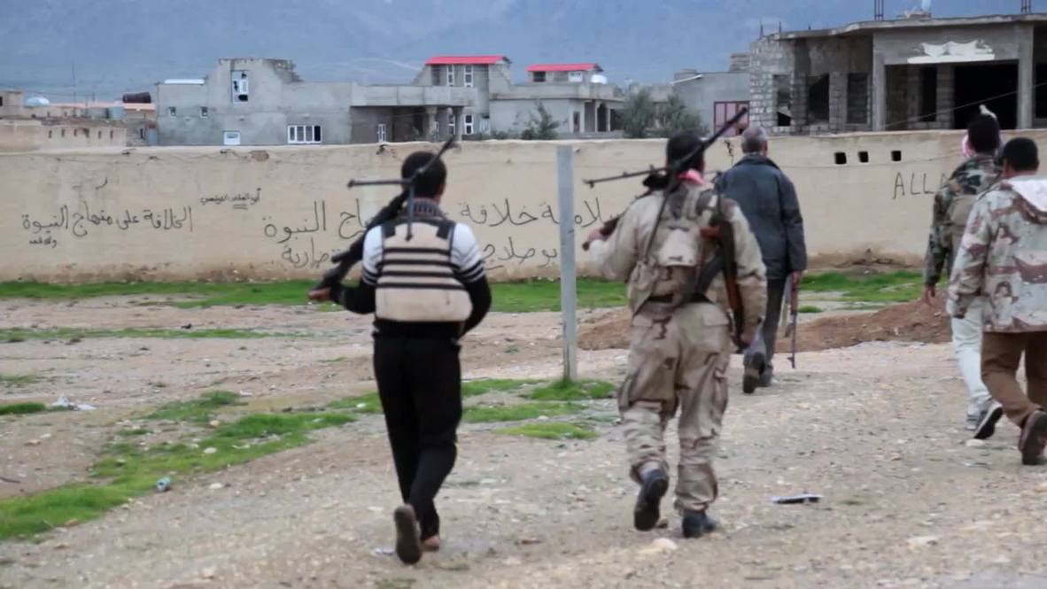 Iraq: Yazidi fighters liberate 'corpse-strewn' town
