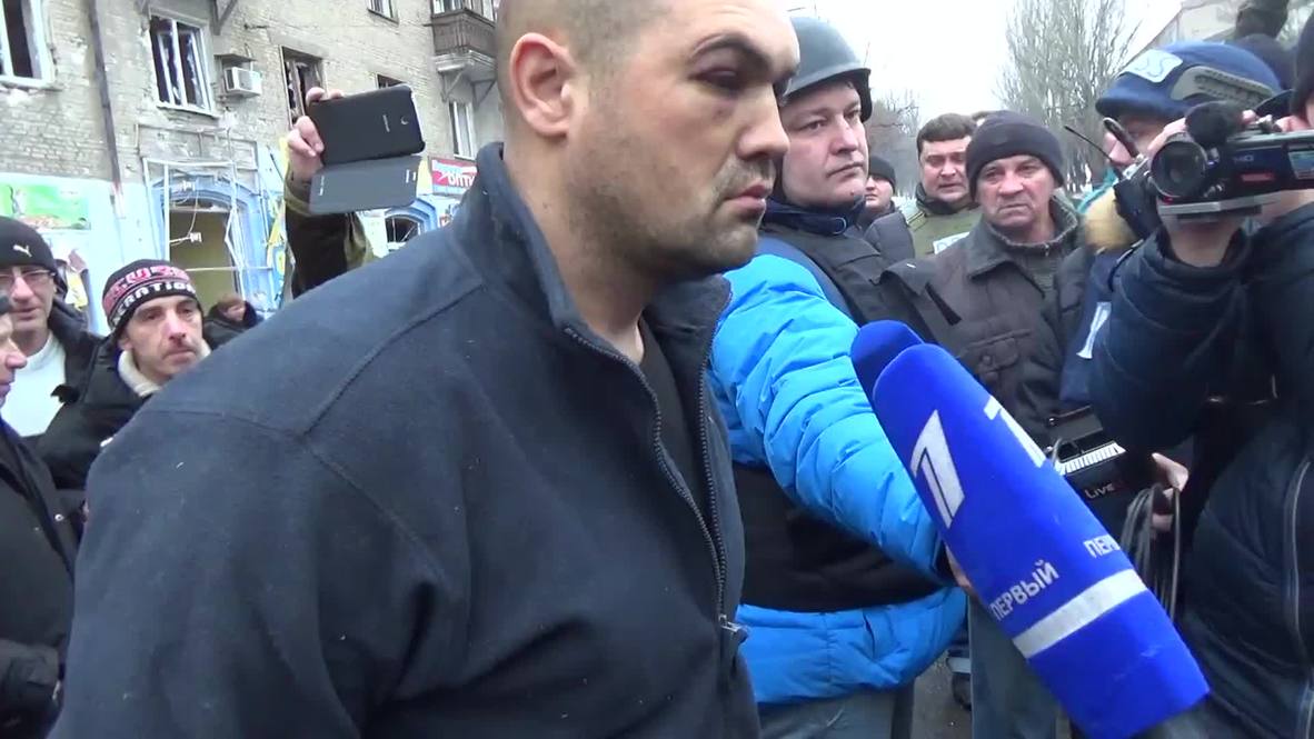 Ukraine: DPR force "guilty" Kiev officer to see aftermath of deadly tram shelling