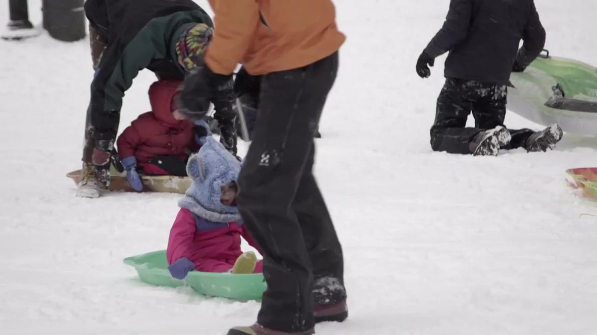 USA: SCHOOL'S OUT! Storm Juno BLIZZARD is fun for some