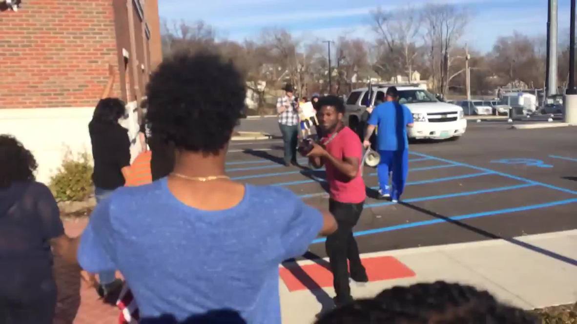 USA: Ferguson protesters rip up and trample on U.S. flags