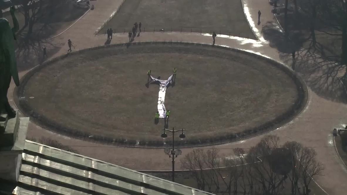 Russia: Greenpeace activists unfurl MASSIVE anti-pollution banner in St. Petersburg