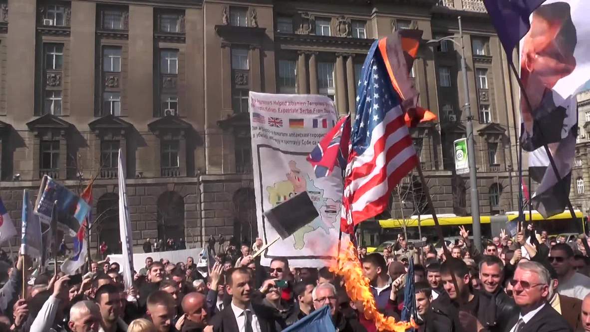 Serbia: Watch anti-NATO protesters burn EU & US flags
