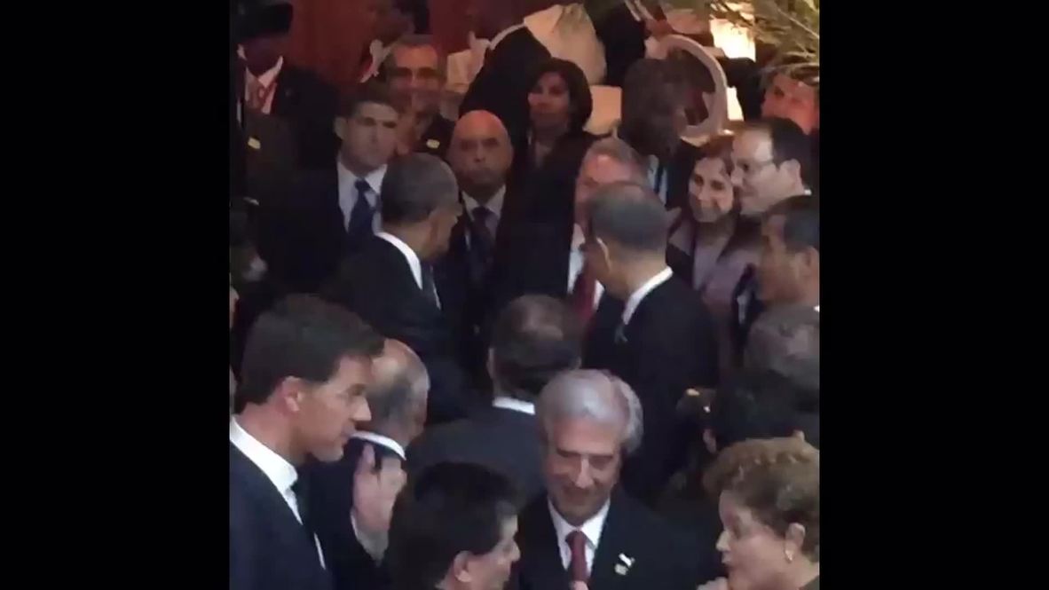 Panama: Obama and Castro share handshake ahead of historic meeting