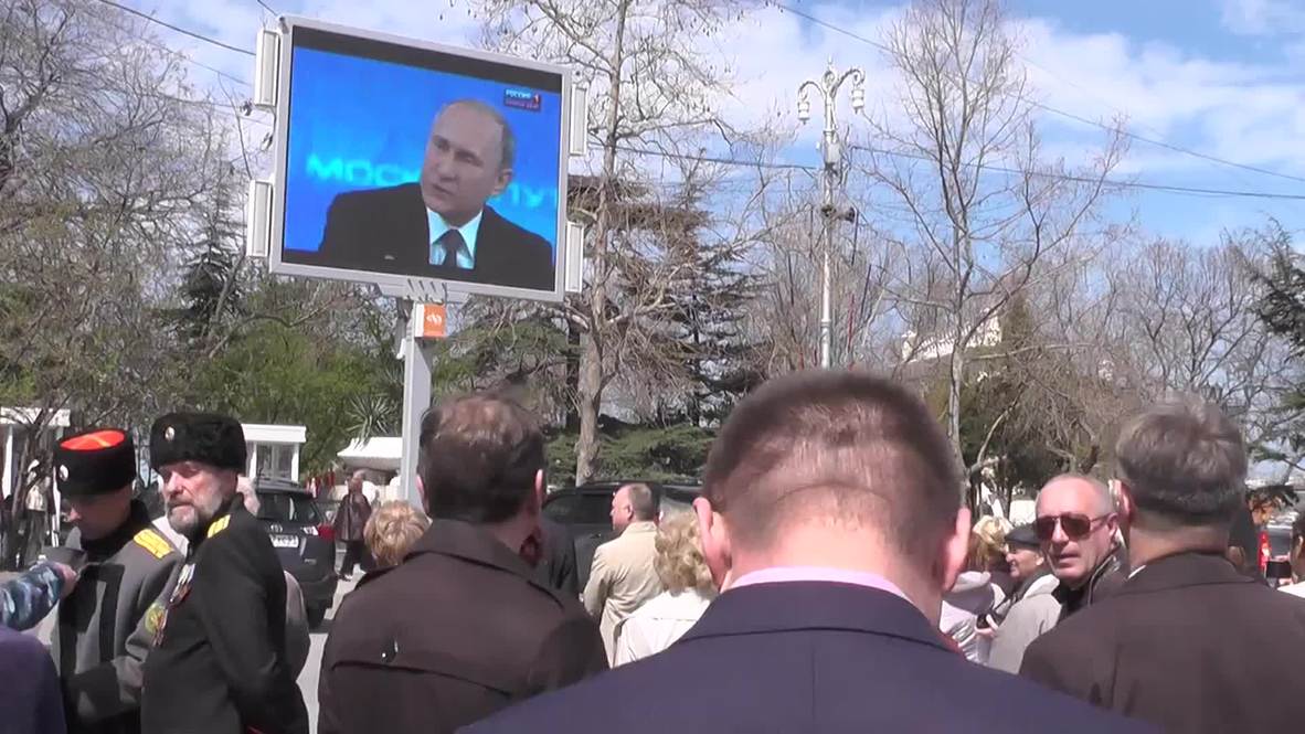 Russia: Sevastopol residents watch Putin from central square