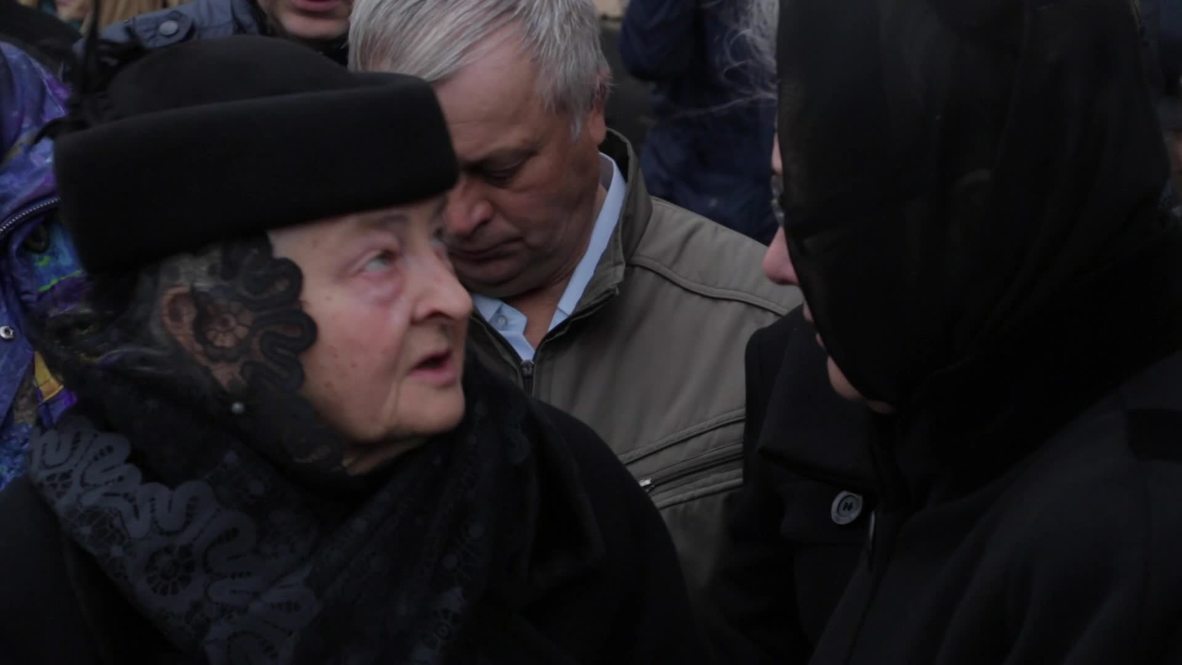 Ukraine: Mourners gather in front of Oles Buzina’s house ahead of funeral