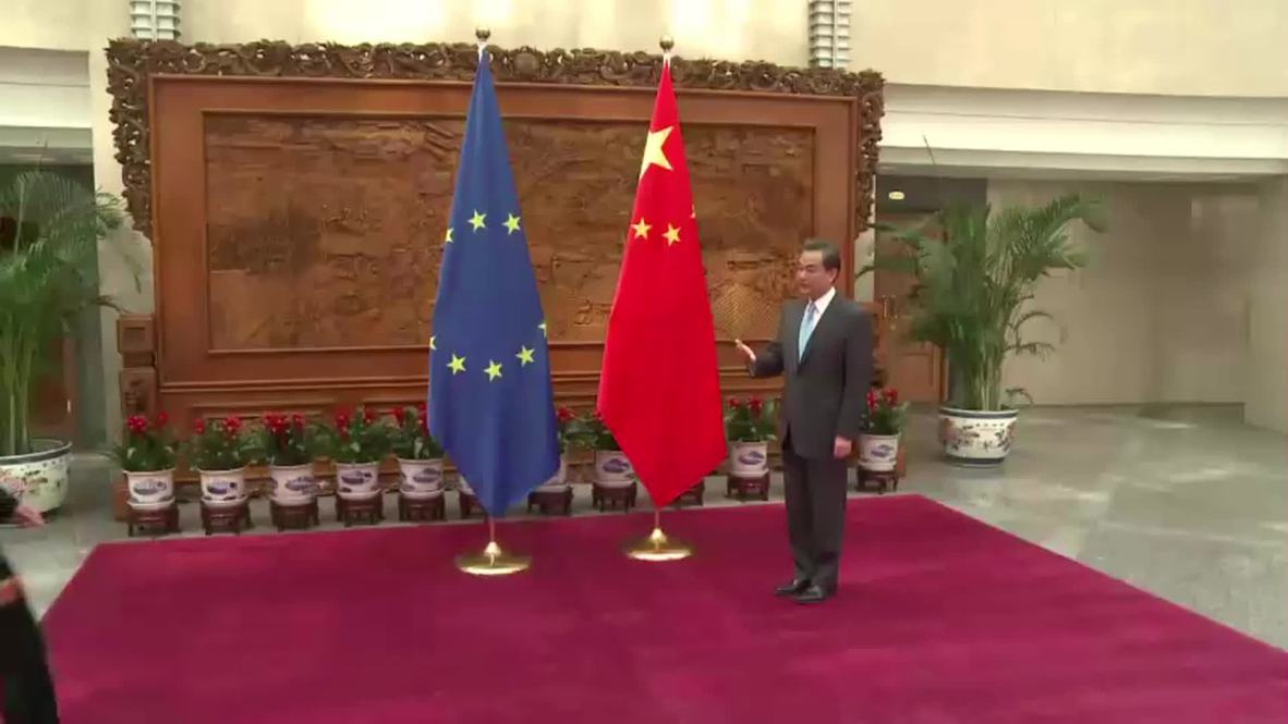 China: Foreign Minister Wang Yi greets the EU's Mogherini in Beijing