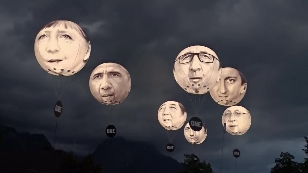 Germany: Anti-G7 activists rally against "hot air" leadership with hyper-realistic balloons