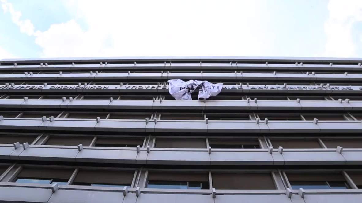 Greece: Huge anti-austerity banner unfurled on finance ministry in Athens