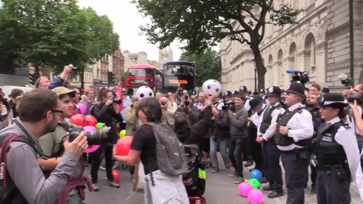 UK: 'Balls to the budget' - Anti-austerity protesters rally outside Downing Street