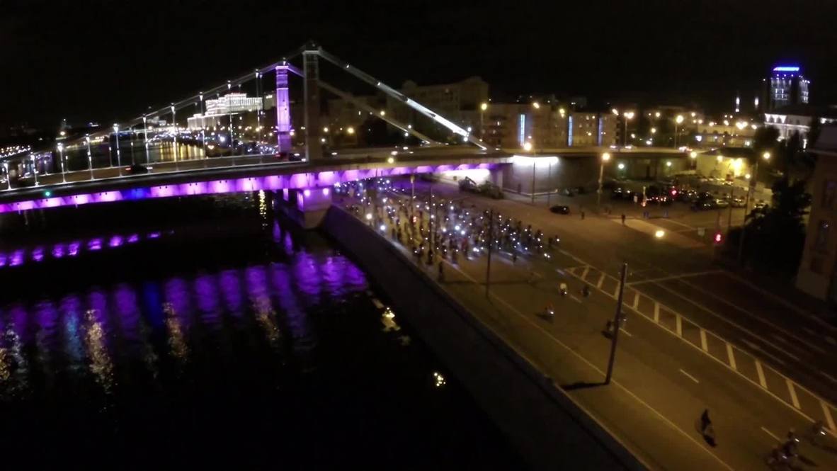 Russia: Drone captures night-time cycle parade illuminating Moscow's streets