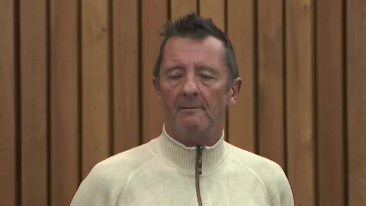 New Zealand: AC/DC drummer Phil Rudd leaves court after re-arrest