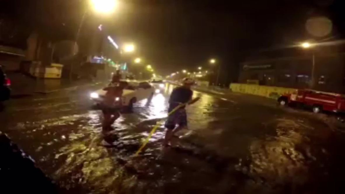 Russia: Daredevils SURF on flooded Vladivostok roads
