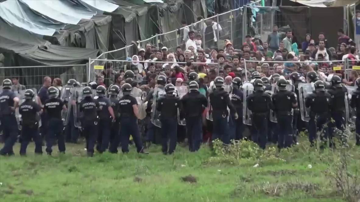 Hungary: Riot police use tear gas as refugees attempt to break out of detention camp