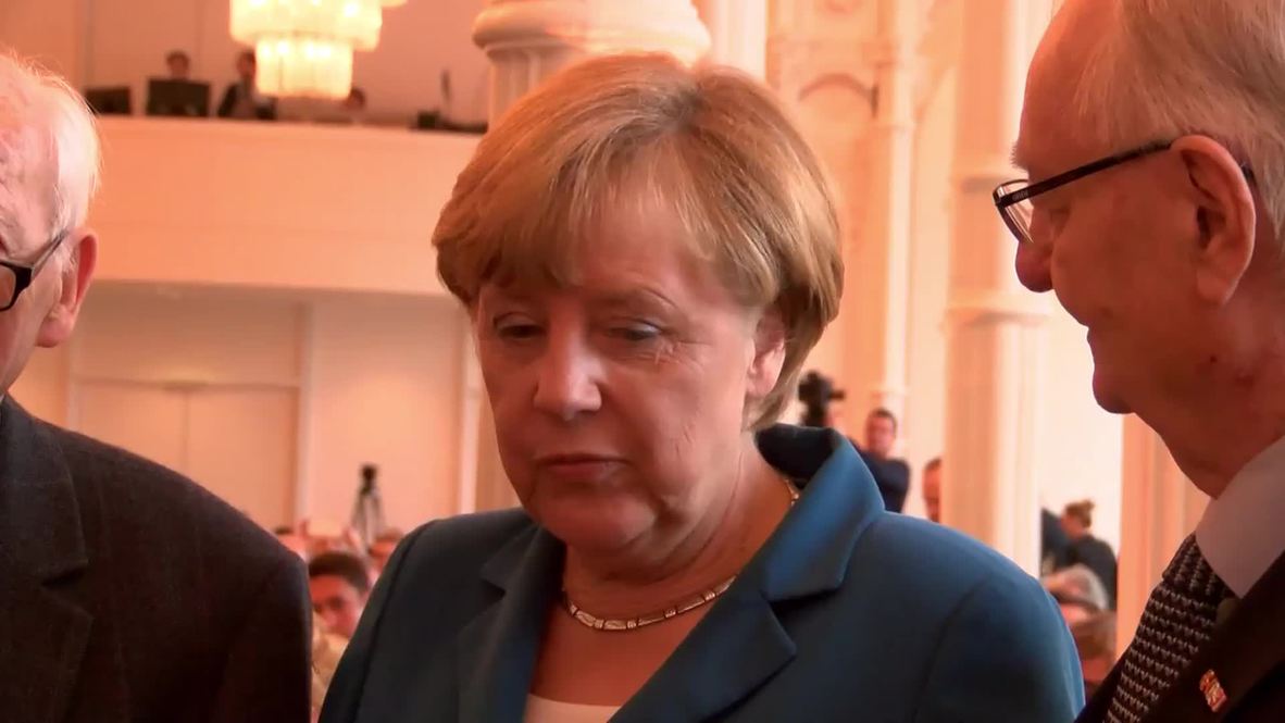 Germany: Refugees must be helped whether 'we want to or not' - Merkel