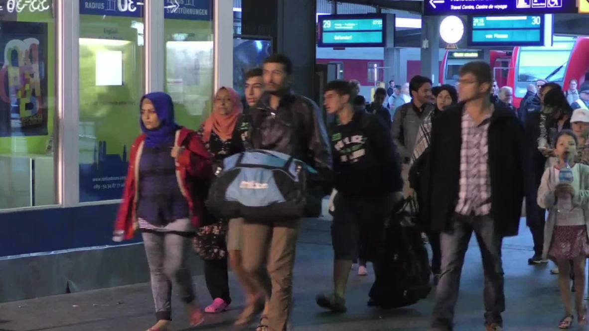 Germany: Refugees receive donations on arrival in Munich