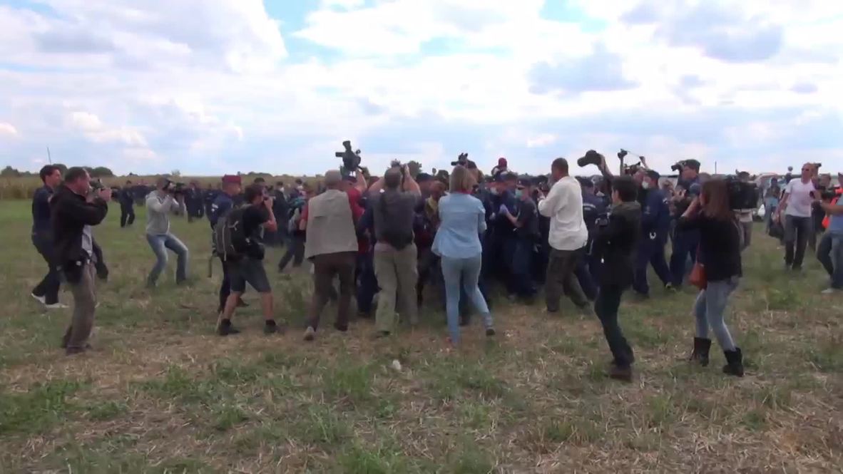 Hungary: Journalist KICKS refugees fleeing police at border camp